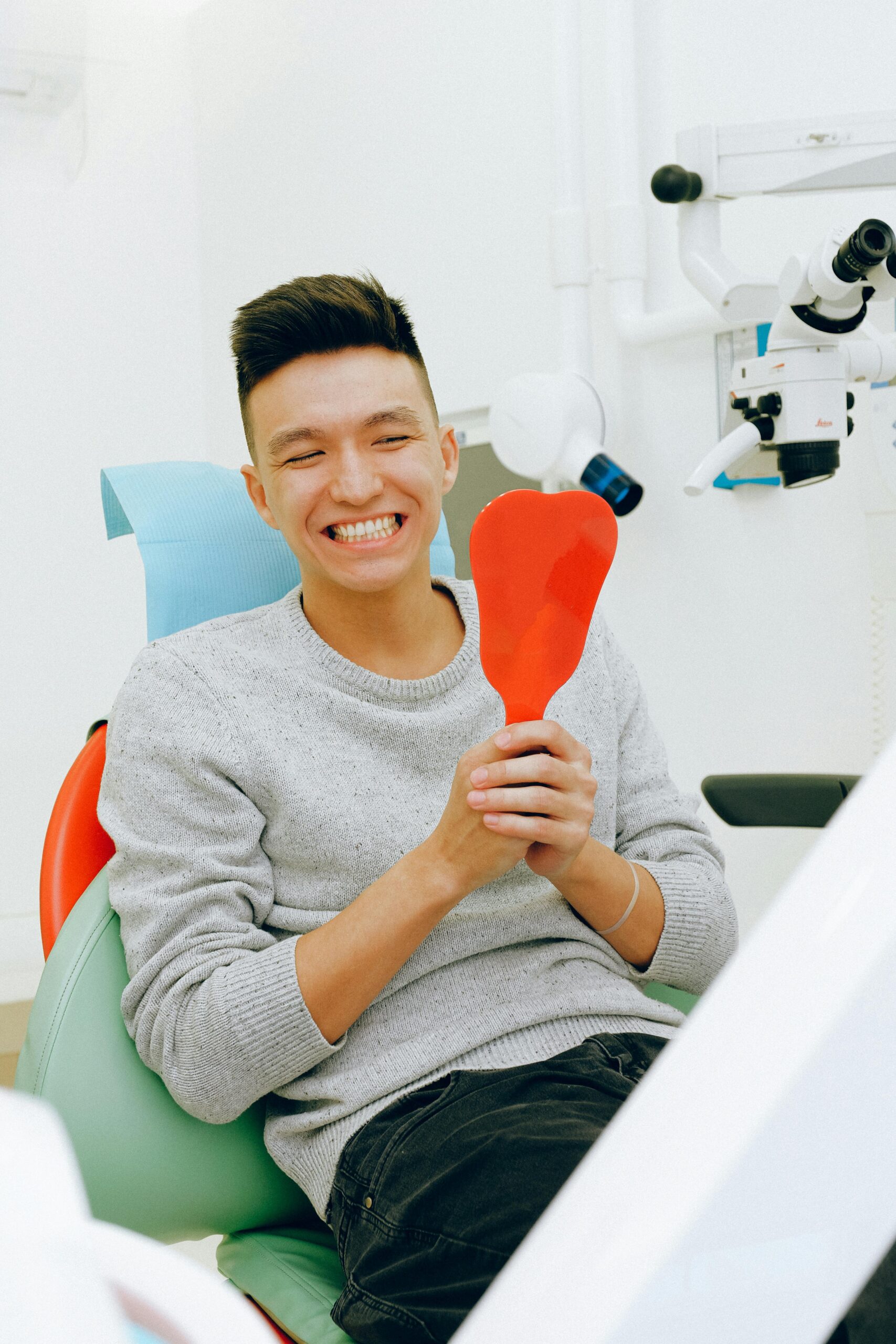 A relaxed, smiling patient in the dental chair